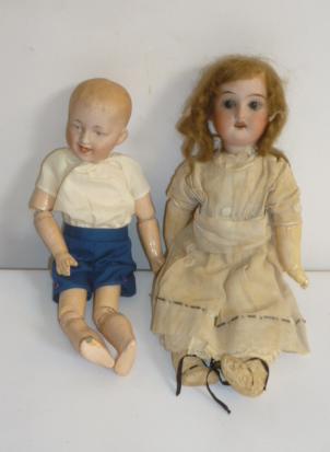 A Gebruder Heubach bisque head character boy doll with intaglio eyes Image