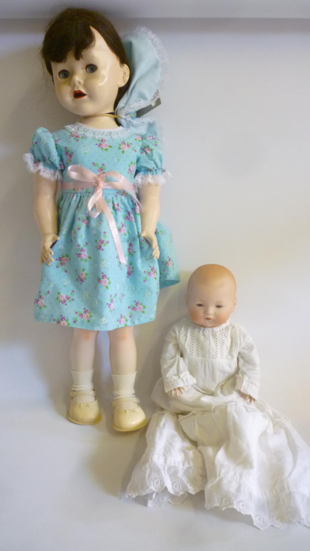 An Armand Marseille bisque head crying Dream Baby doll with blue glass sleeping eyes Image