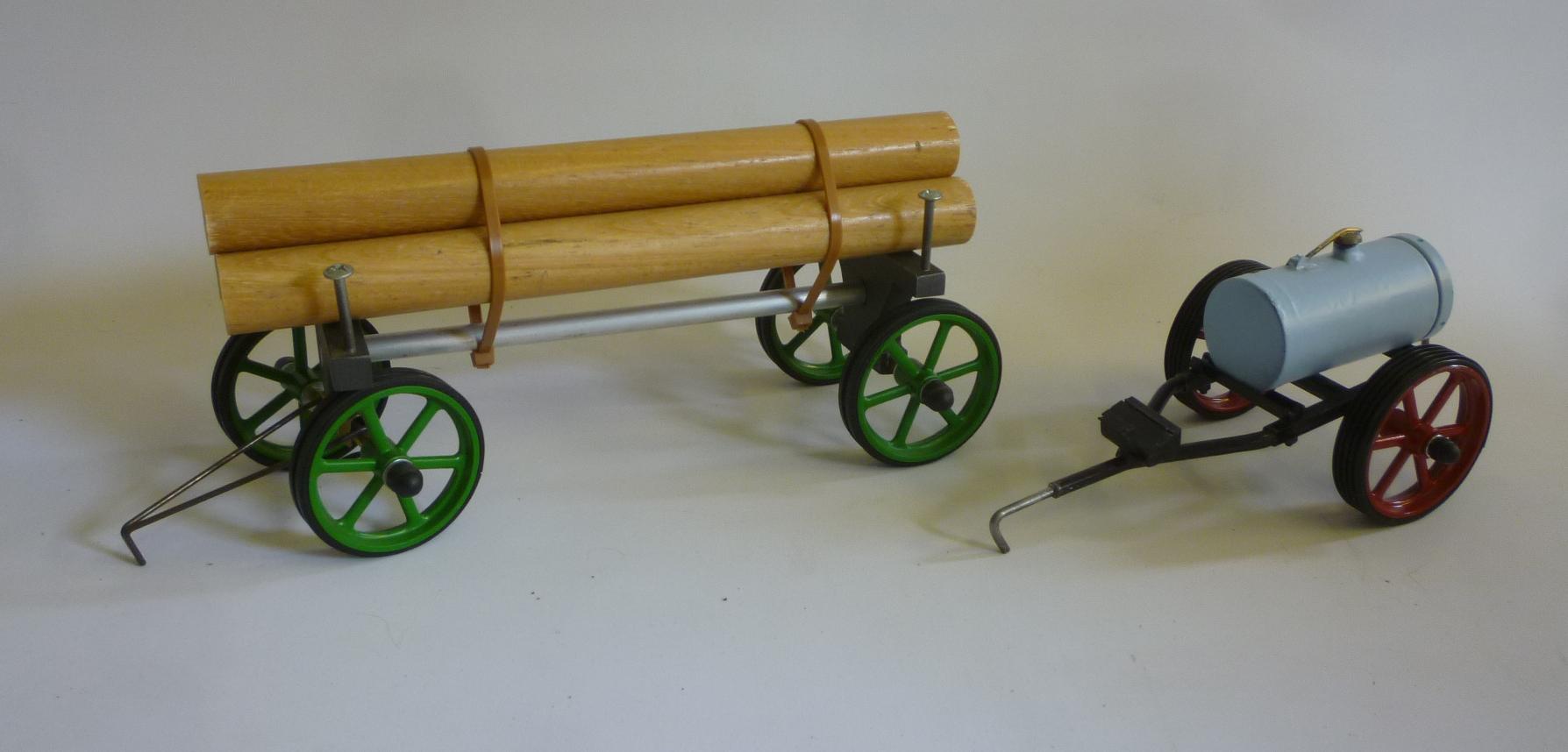 A Mamod four wheel timber trailer with three logs Image