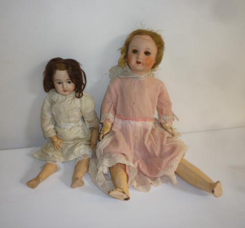 A Limoges bisque head with fixed blue glass eyes Image