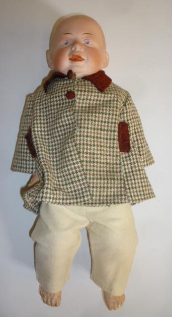 A Gebruder Knoch bisque shoulder head boy character doll with intaglio eyes Image