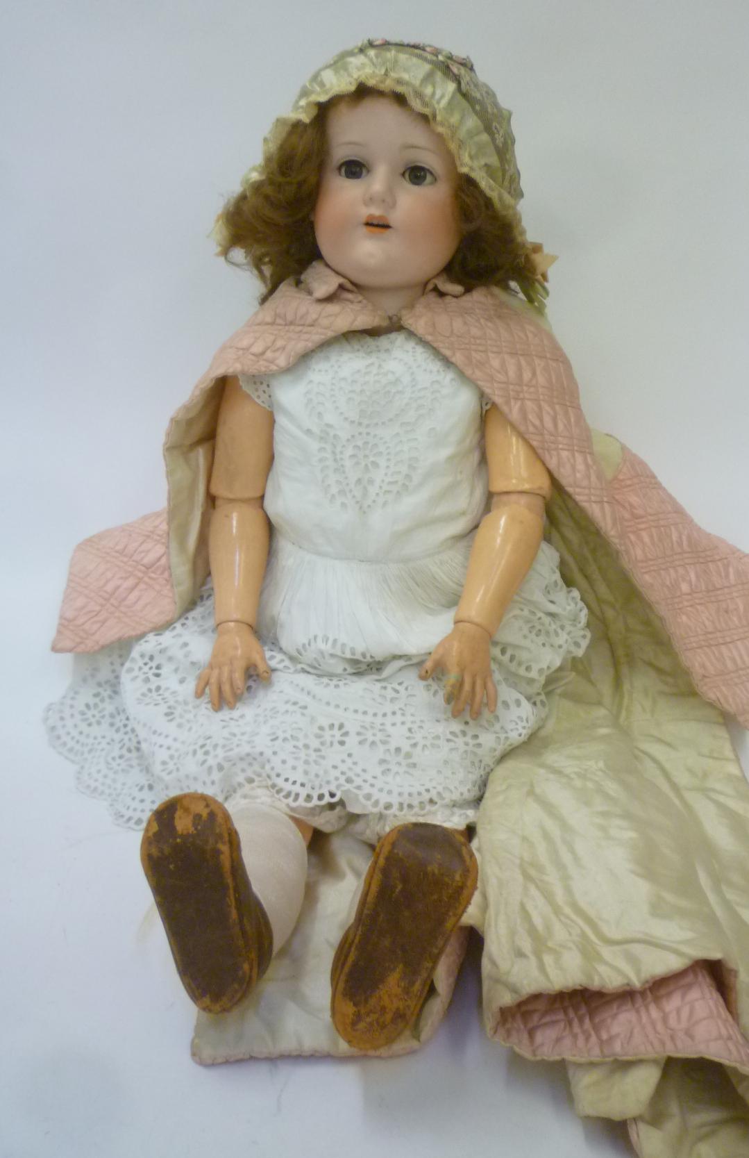 A C.M. Bergmann bisque head doll with blue glass sleeping eyes Image