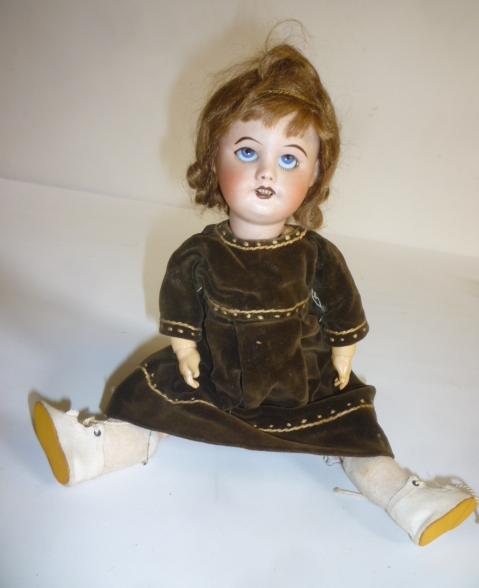 A French SFBJ bisque head doll with blue glass sleeping eyes Image