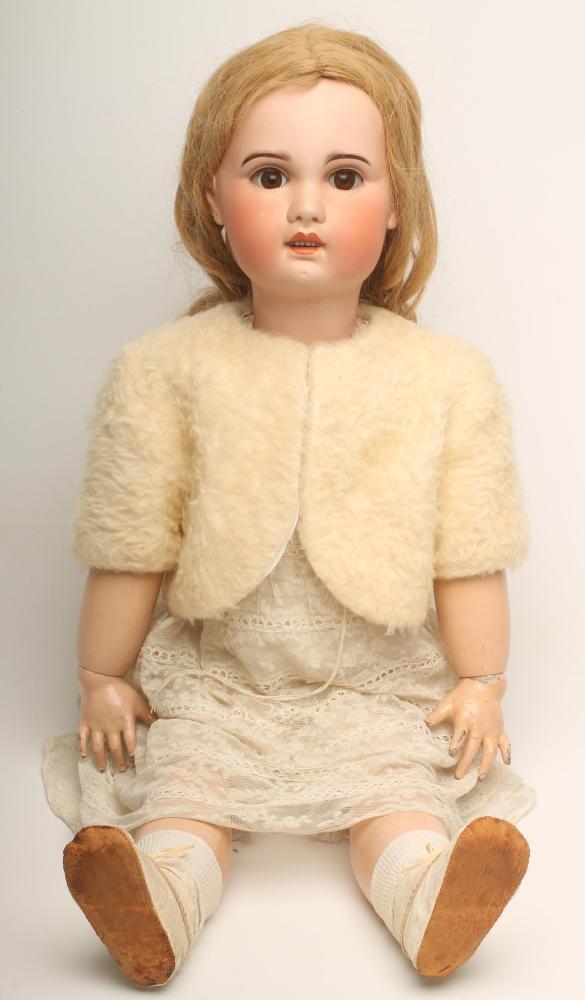 A Jumeau S.F.B.J. bisque head doll with brown glass sleeping eyes Image