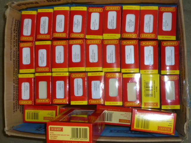 Thirty two Hornby goods wagons including private owner coal trucks Image