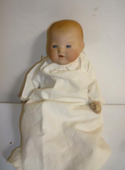 An Armand Marseille Chinese bisque head baby doll with blue glass sleeping eyes Image