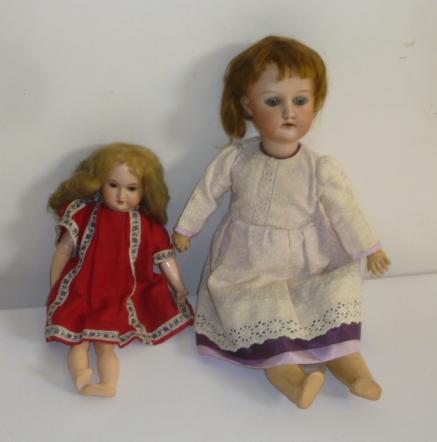 An Armand Marseille bisque head doll with blue glass sleeping eyes Image