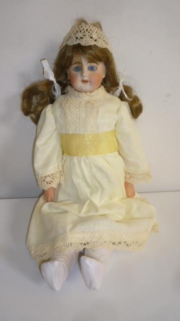 A Bahr & Prothschild bisque shoulder head doll with blue glass sleeping eyes Image