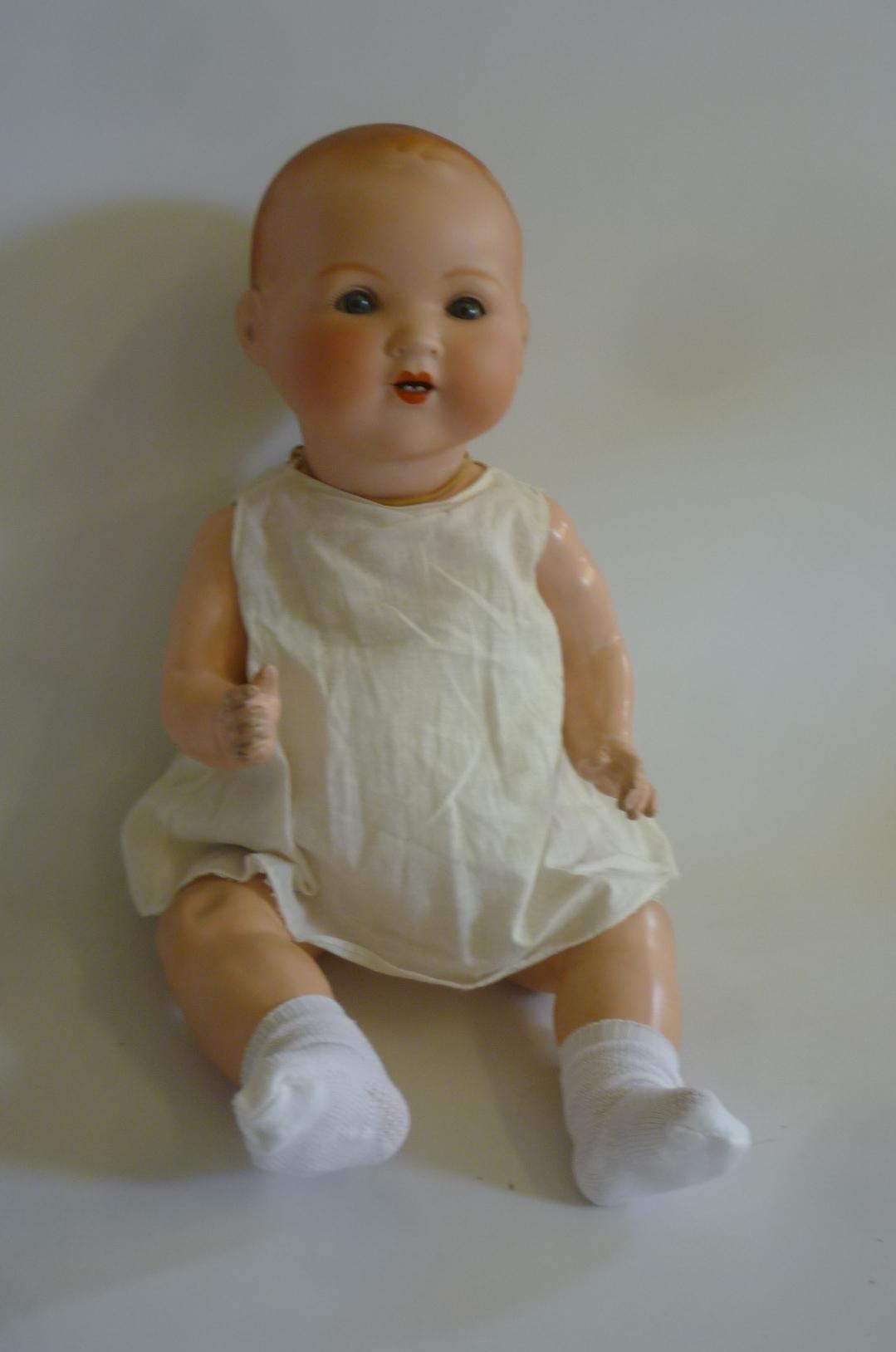 An Armand Marseille bisque head "Dream Baby" doll with blue glass sleeping eyes Image