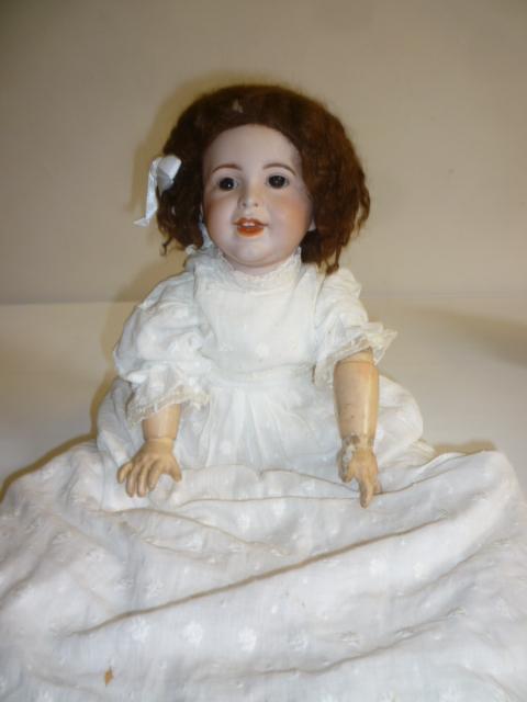 A French SFBJ bisque head character doll with brown glass sleeping eyes Image