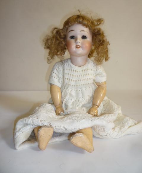 A Limbach "Wally" bisque head doll with blue glass sleeping eyes Image