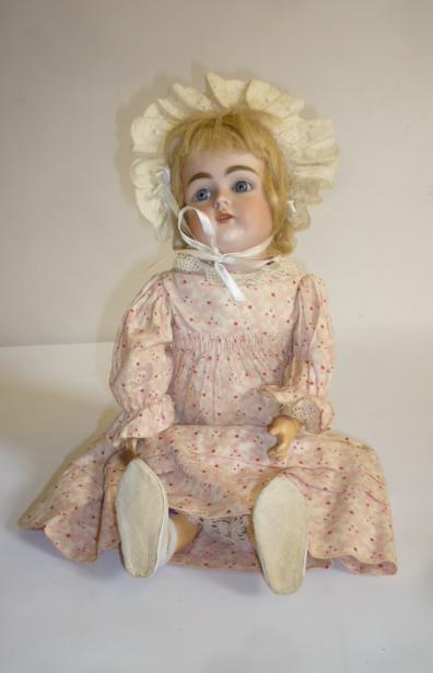 A Kestner bisque head doll with blue glass sleeping eyes Image