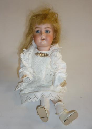 An Armand Marseille Floradora bisque head doll with blue glass sleeping eyes Image