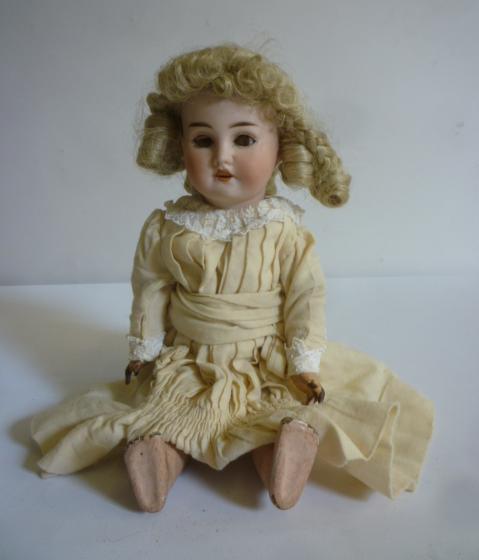 A French Jumeau bisque head doll with brown glass sleeping eyes Image