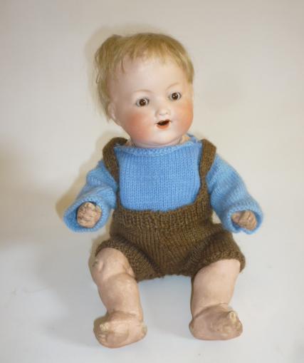 An Armand Marseille bisque head boy doll with brown glass sleeping eyes Image