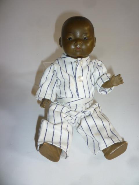 An Armand Marseille oriental black baby with bisque head Image