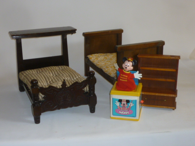 A dolls' stained wood half tester bedstead with carved footboard Image