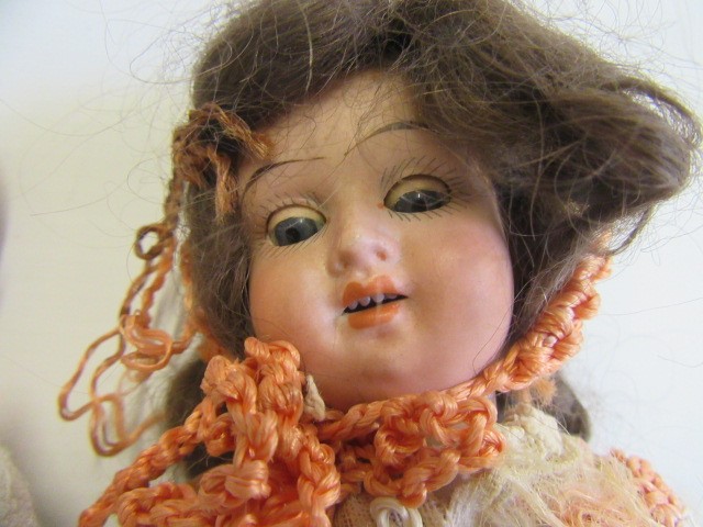 A Heubach bisque shoulder head 'solemn' doll Image