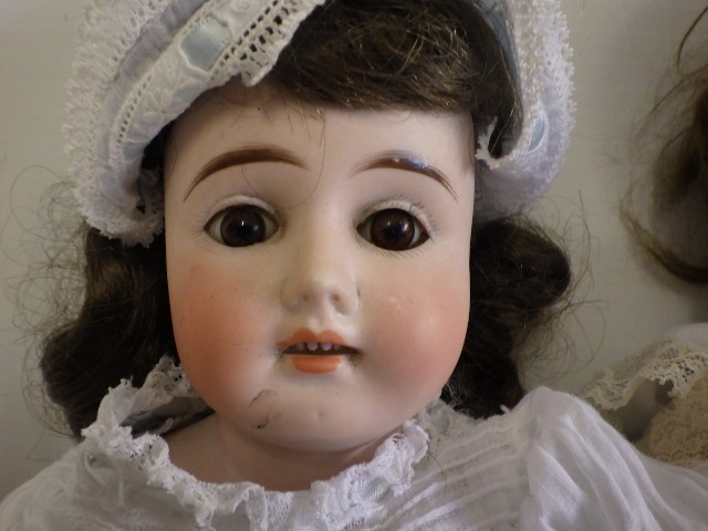 An Armand Marseille "Floradora" Bisque shoulder head doll Image