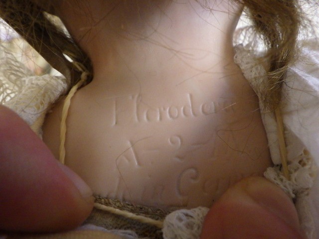 An Armand Marseille "Floradora" Bisque shoulder head doll Image