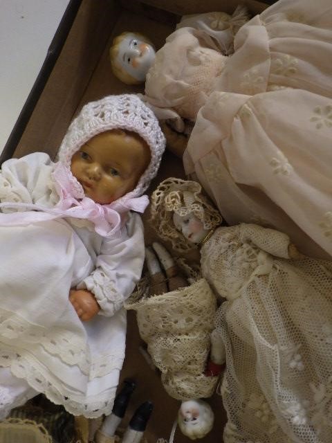 A collection of eight doll's house and miniature bisque head dolls Image