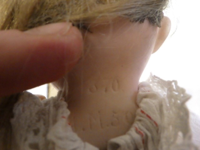 An Armand Marseille bisque shoulder head doll Image