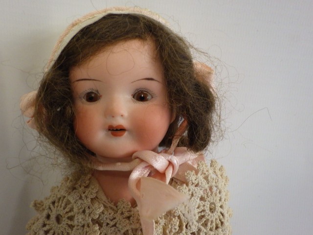An Armand Marseille bisque shoulder head doll Image