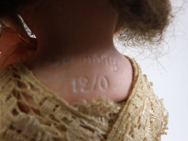 An Armand Marseille bisque shoulder head doll Image