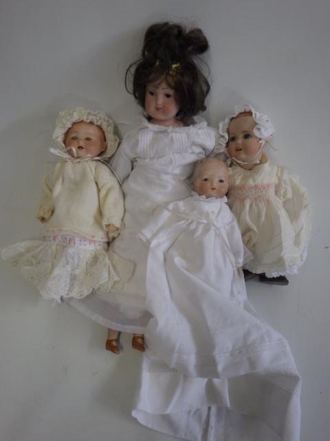 Four bisque head dolls comprising two Armand Marseille baby dolls with sleeping eyes Image