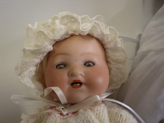Four bisque head dolls comprising two Armand Marseille baby dolls with sleeping eyes Image