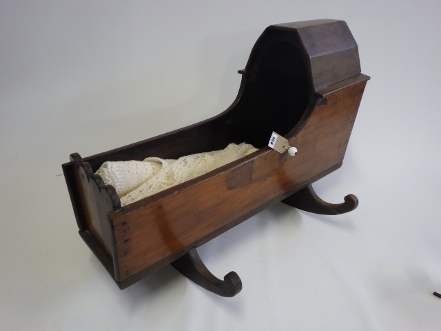 A Victorian mahogany doll's crib Image