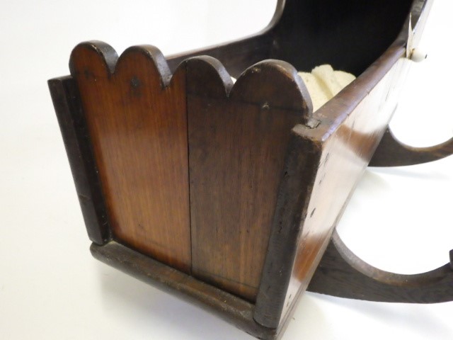 A Victorian mahogany doll's crib Image