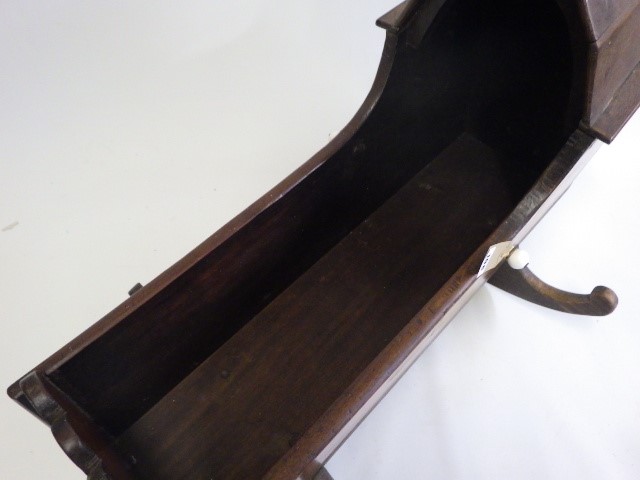 A Victorian mahogany doll's crib Image