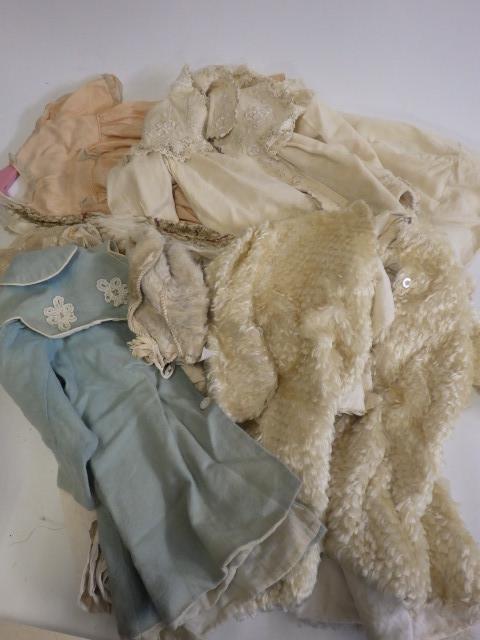 A large quantity of doll's clothing and accessories including antique pieces Image
