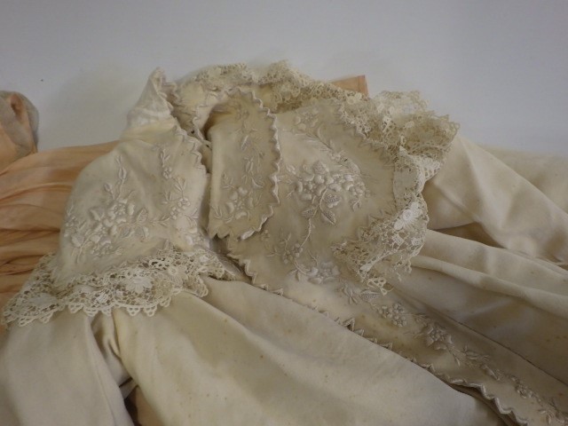 A large quantity of doll's clothing and accessories including antique pieces Image