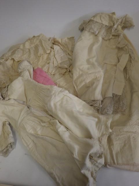 A large quantity of doll's clothing and accessories including antique pieces Image
