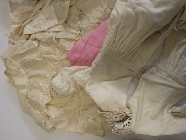 A large quantity of doll's clothing and accessories including antique pieces Image