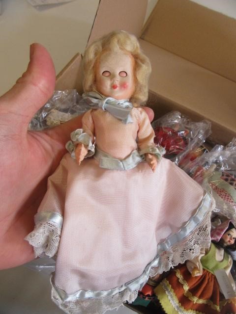 A collection of approximately thirty eight miniature world dolls Image