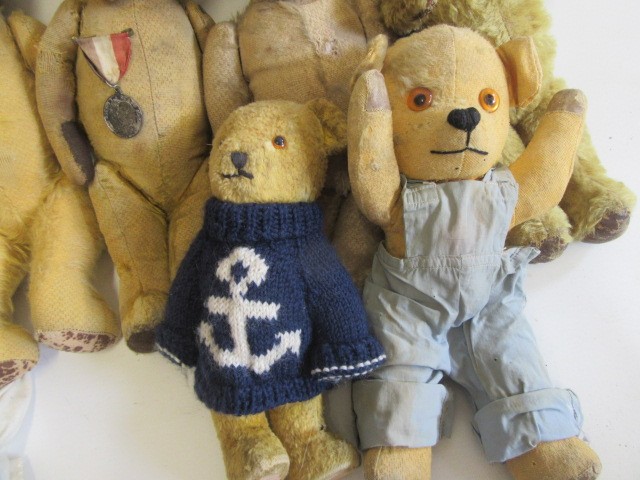 A collection of seven vintage teddy bears Image