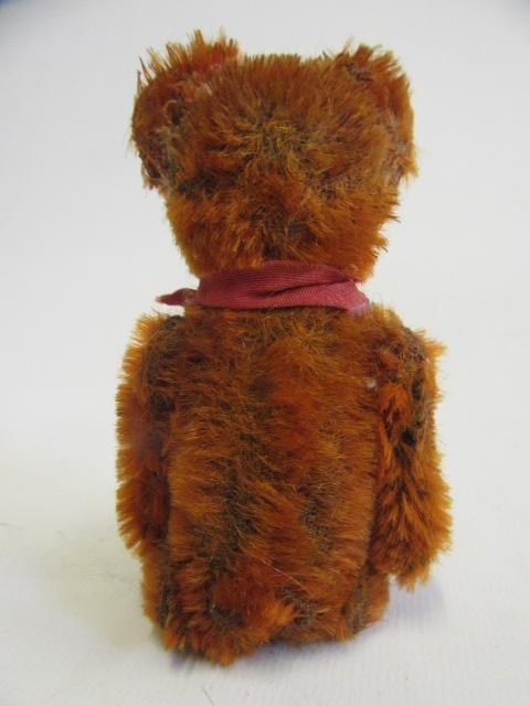 A rare pre-war dark orange Schuco teddy Image