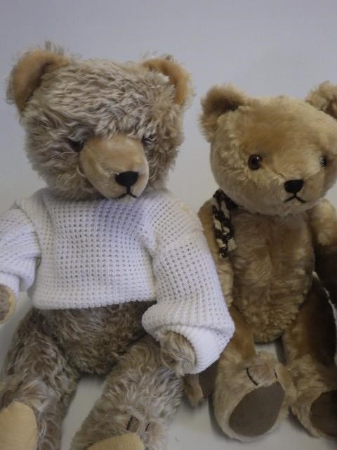 Four stuffed animals comprising a large camel Image