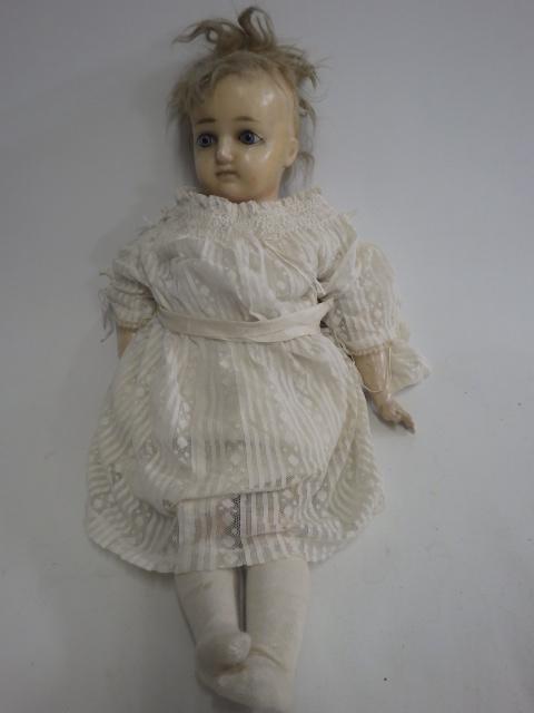 A wax shoulder head doll Image