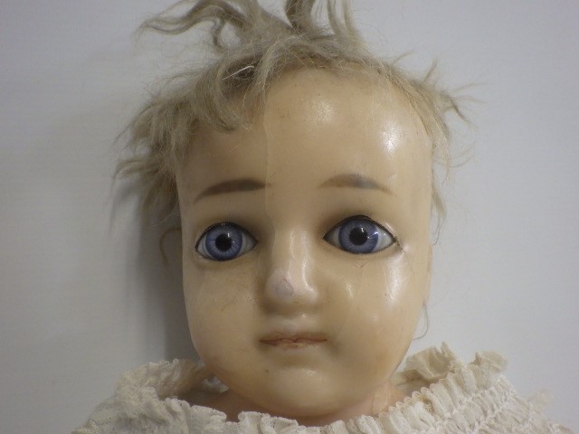 A wax shoulder head doll Image