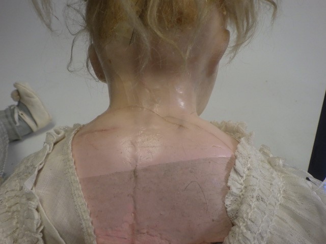 A wax shoulder head doll Image