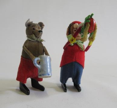 Schuco clockwork monkey with small dog and mouse with tankard Image