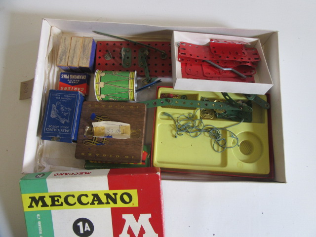A small quantity of Meccano parts including tyres and Magic Clockwork motor Image