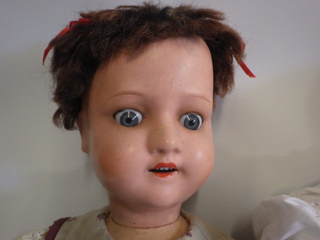 A composition socket head doll Image