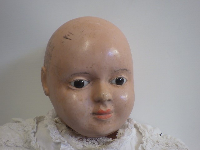A composition socket head doll Image
