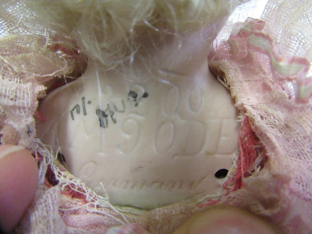 An Armand Marseille bisque shoulder head marotte doll Image