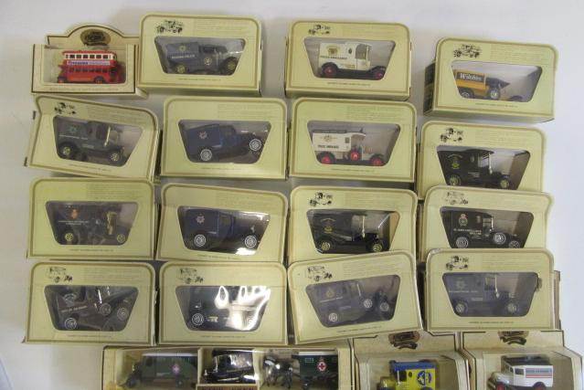 Nineteen Lledo Days Gone and Matchbox Models of Yesteryear vans and bus Image